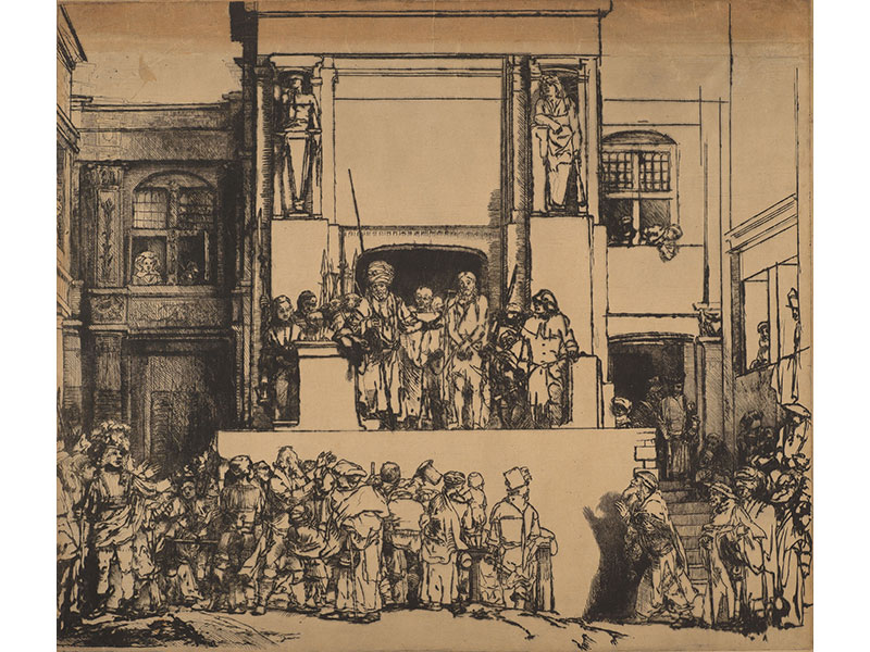 Figures standing on platform behind more figures in foreground.